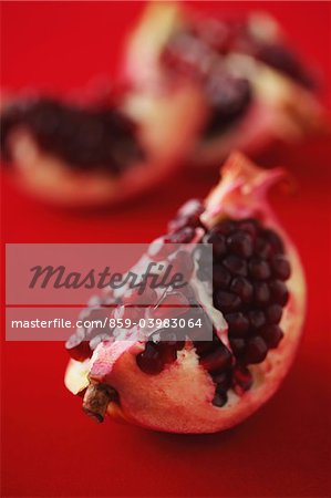Slices Of Pomegranate On Red Background Slices Of Pomegranate On Red Background