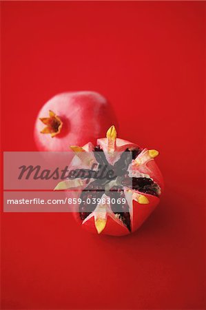 Pomegranates On Red Background Pomegranates On Red Background
