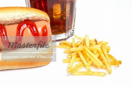 Hot dog, soda glass and french fries on white background. Shallow DOF