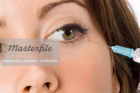 Portrait of fresh and beautiful woman getting botox injection