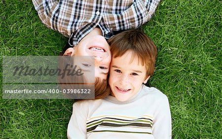 Boys Laying in the Green Grass