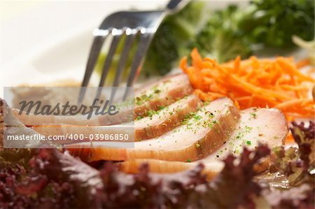 Sliced ham with vegetables