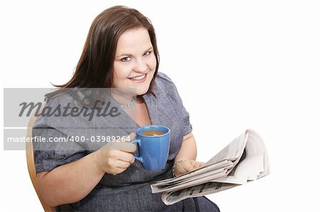 Pretty plus-sized businesswoman drinking coffee and reading the paper.  Isolated on white.