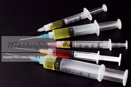 A set of prescription pharmaceutical medical syringes.