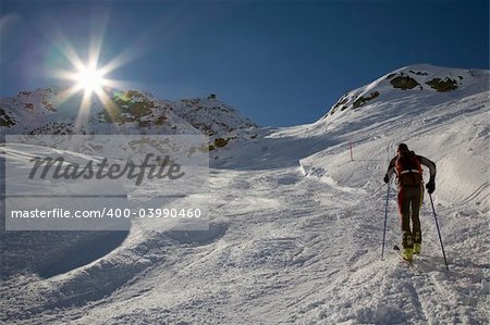 A lone backcountry skier (ski touring), west alps, Europe.