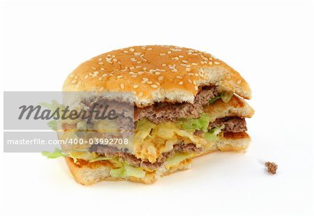 half-eaten delicious hamburger on white