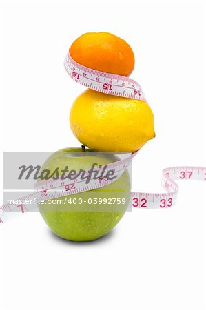 Weight loss and healthy dieting concept. Apple, lemon and mandarin with measure tape. Isolated over white.