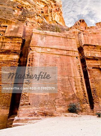 Uncompleted tomb in Petra (Street of Facades part) - Nabataeans capital city (Al Khazneh) , Jordan. Made by digging a holes in the rocks. Roman Empire period.