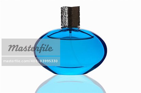 Blue perfume bottle with reflection on white background