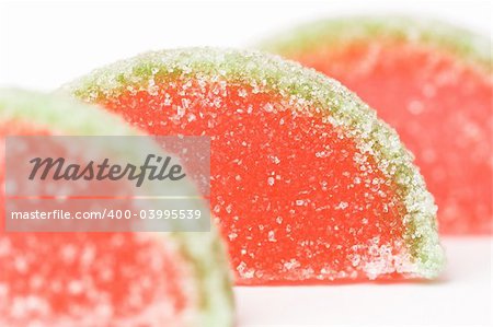 Close-up of fruit flavored jelly candies covered with sugar, shallow dof.