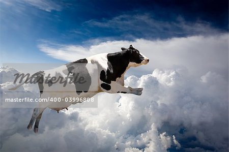 A super cow flying over clouds