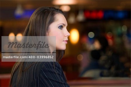 portrait of a young cute girl with light and color on background