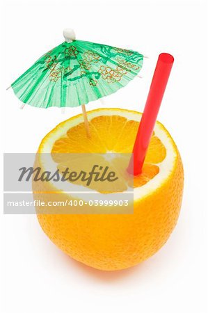 Chopped orange with drinking-straw and a small umbrella. Isolated on a white background.