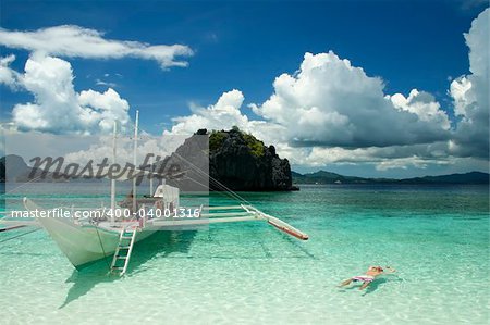 tourists exploring the bacuit archipeligo, el nido palawan island, in the philippines