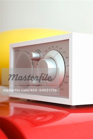 A modern radio set with retro design, white and silver metal