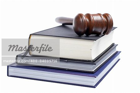 Wooden gavel from the court and law books isolated on white background. Shallow DOF