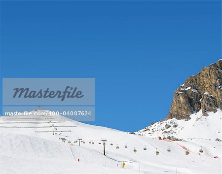 snow rocks and nice mountians over blue sky