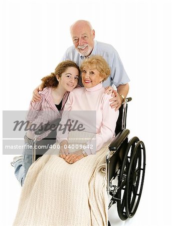 Disabled senior lady with her loving husband and granddaughter.