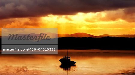 Fishing boat and amazing sunset