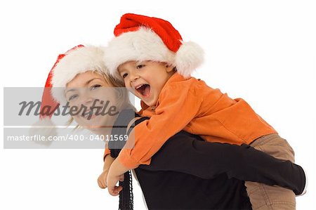Woman and little boy playing in santa hats - studio shot - isolated
