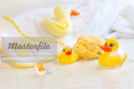 Bathtime for baby with toys and towel