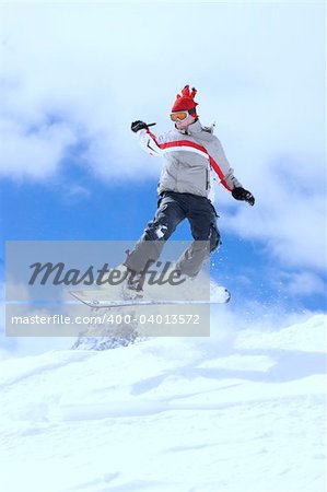 snowboarder taking jump in fresh fallen snow