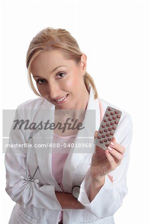 A female doctor holding  or recommending medication in a foil blister pack