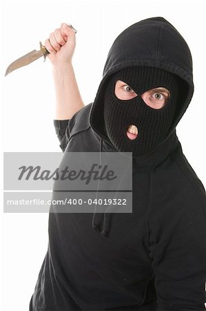 evil criminal wearing balaclava with a knife