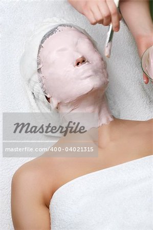 beauty salon series. applying of cleaning facial mask.