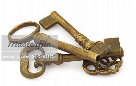 close-up of three ornamented old keys isolated on white background
