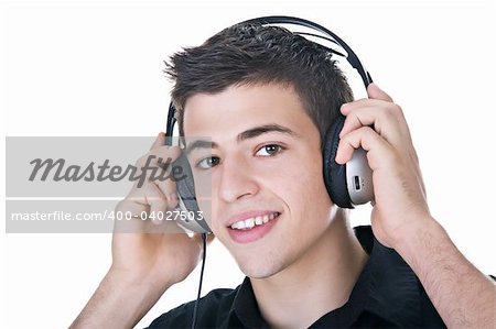 Young man, enjoying music with headphones. Isolated on white.