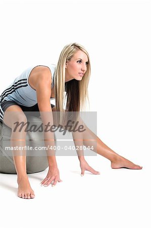 Woman working out on a gym ball.