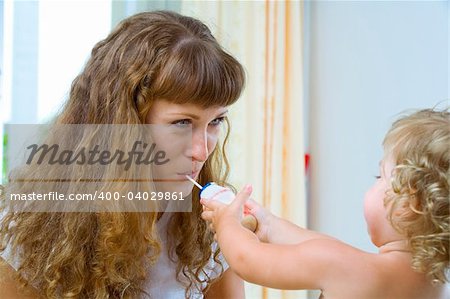 High key portrait of happy mother with baby