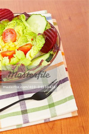 Mediterranean salad with lettuce tomatoes cucumber and beet. Shallow depth of field