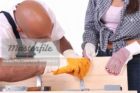 construction workers at work on white background