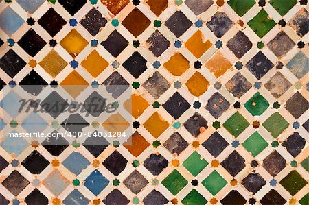 A view of decorative ceramic artwork found on a wall at the Alhambra castle in Granada, Spain.  Suitable for an abstract background.