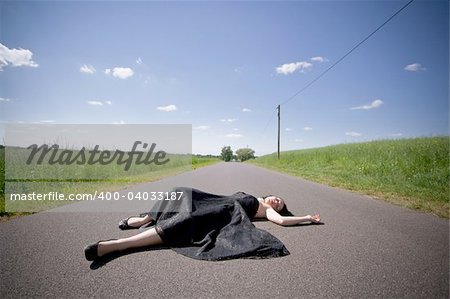 girl laying on the street