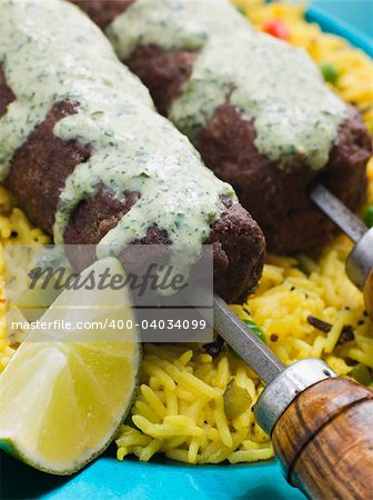 Plate of Lamb Mint and Garlic Sheesh Kebab with Pilau Rice and Raita