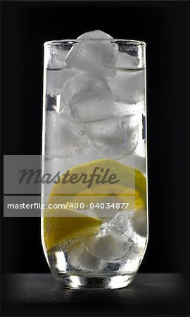 ice and lemon in sparkling water