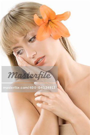 blond girl keeping her face on her hand and having a orange flower between hair