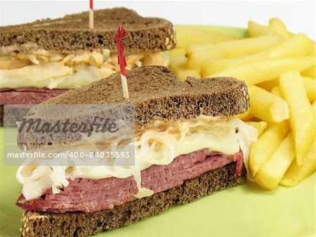 Reuben sandwich with corned beef, melted swiss cheese, sauerkraut, and thousand island dressing on pumpernickel rye bread. Served with french fries.