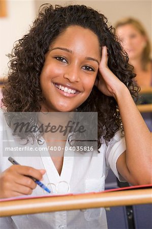 Female college student listening to a university lecture