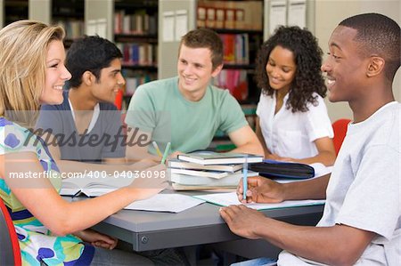 College students studying together in a library