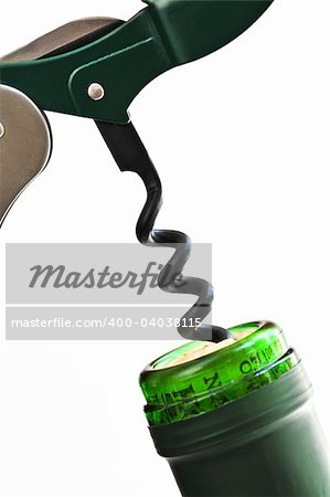 Opening wine bottle with a corkscrew on white background