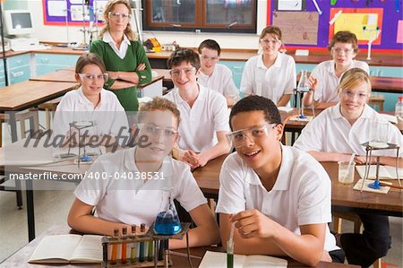 Schoolchildren and teacher in science class