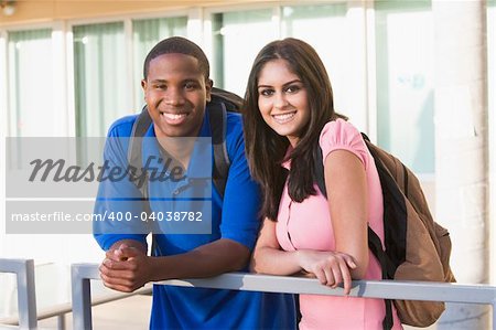 Male and female university students on campus
