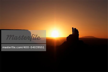 Scenic sunset landscape of mesas in Monument Valley near the border of Arizona and Utah, United States.