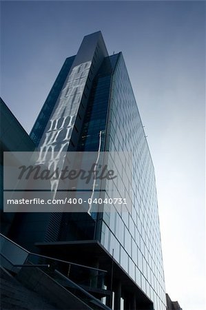 A modern office building against the morning sky