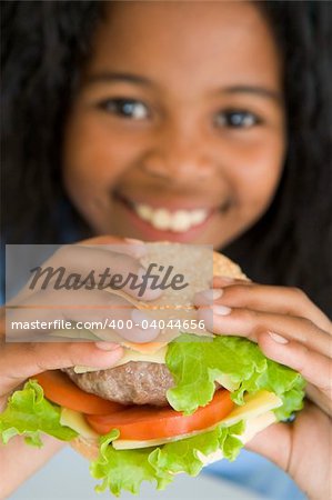 Girl eating healthy burger