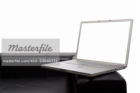 Laptop on modern couch isolated background and screen with clipping paths so you can insert your own items